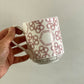 Bone china stacking mug with red Staffordshire knot pattern. Personalised for Box O Fun founder, Layla Hashim with handpainted lettering.