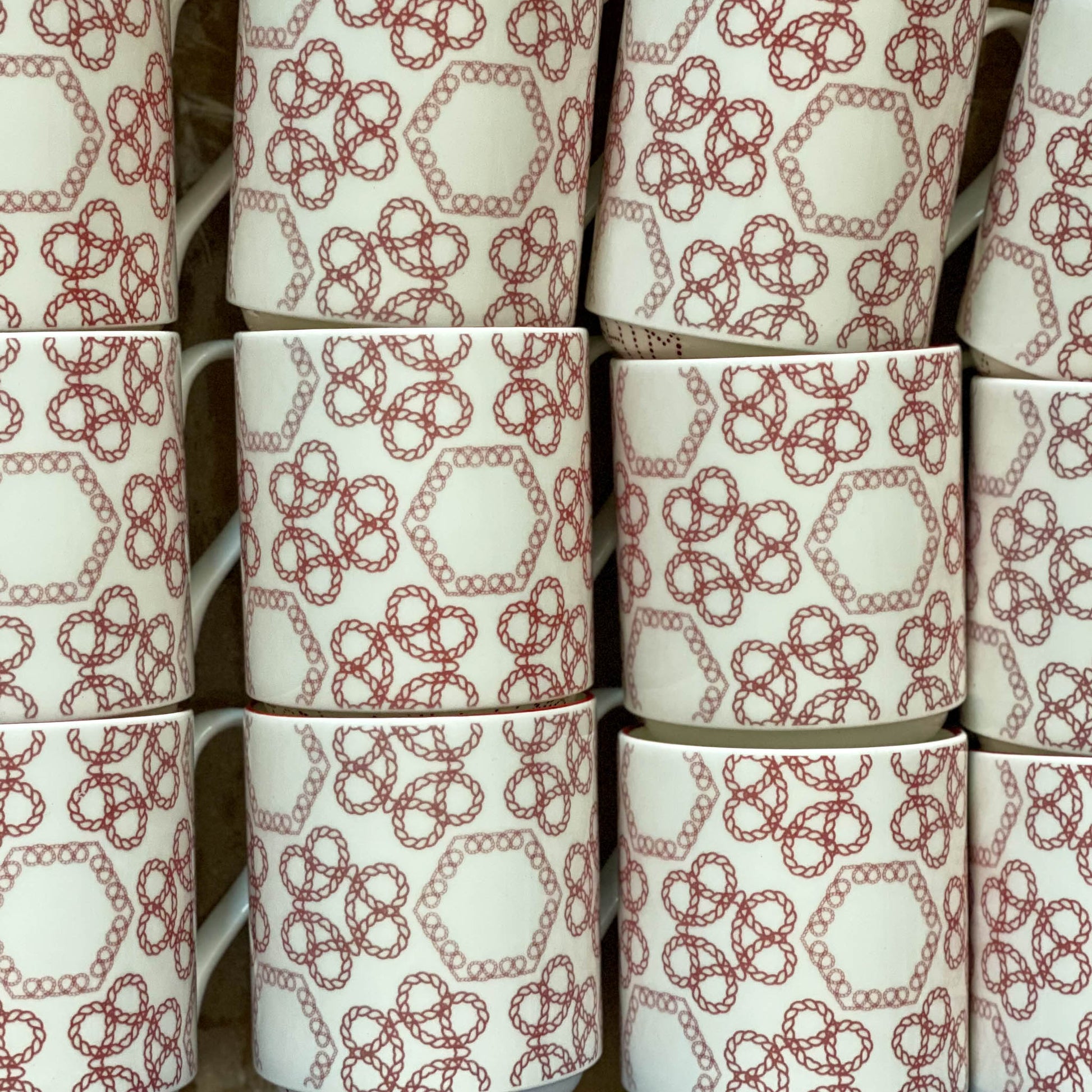 Collection of twelve Staffordshire knot mugs.